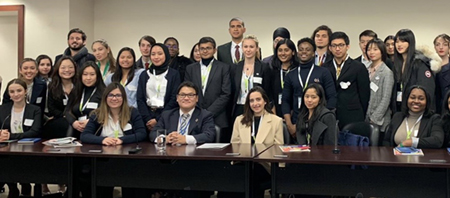 SIUE’s Ozge Ozisiklioglu poses at the UN headquarters with official delegates.