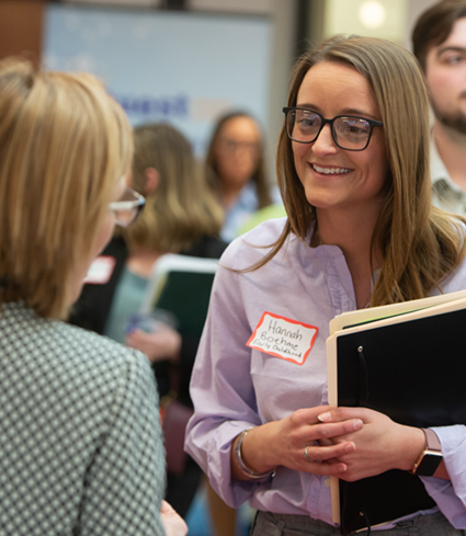 SIUE early childhood education major Jami Gibbs (R) smiles alongside Tracee Wells (L) while learning about the East St. Louis District 189 Urban Education Teacher Residence Program.