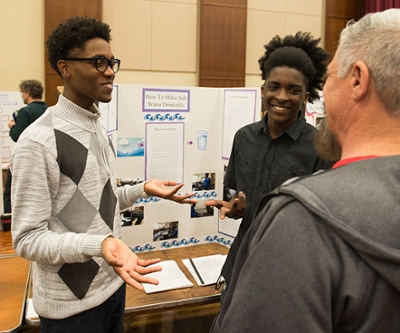 Upward Bound Math and Science students describe their research on How to Make Salt Water Drinkable.