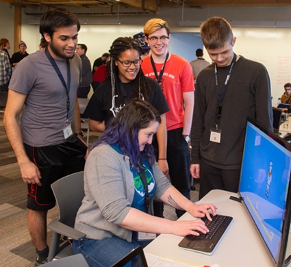 SIUE Associate Professor of Computer Science Dennis Bouvier, PhD, (far right) stands with SIUE student and alumni volunteers.