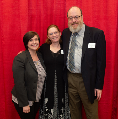 (L-R) CAS Honors Day student speaker Jennifer McBride stands alongside Dr. Laura McCullough and Dr. Tom Foster.