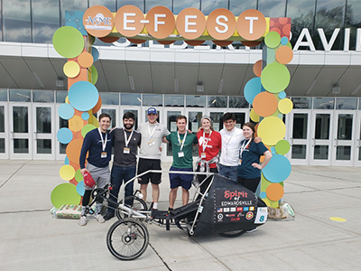 SIUE students stand with The Spirit of Edwardsville, including team members (L-R) Anthony Kindle, Jeffery Clubb, Nathan Kolesa, Joel Eberhart, Tiana Sherman, Jonathan Cheatham and Holly Liebel.