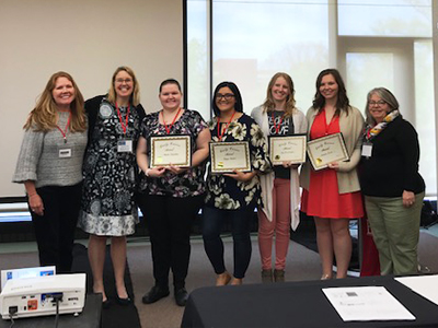 (L-R) Local author Jennifer Ward, SIUE’s Dr. Stephanie McAndrews, secretary of CIRP, SIUE’s Early Career Award winners Jennifer Scheuchner, Meagan Mendez, Kara Brockmeyer and Amanda Acord, and CIRP President Dr. Becky McTague, professor at Roosevelt University. 