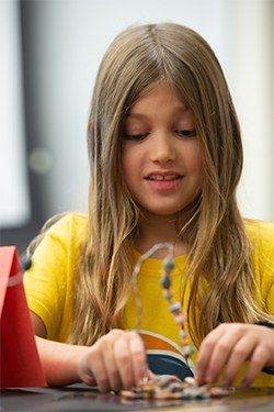 Lyvleigh Burgess works on an art project during the Summer Arts camp at SIUE.