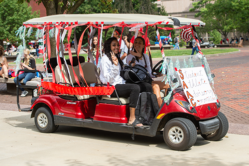 Multiple campus organizations and units participated in the Homecoming golf cart parade. 
