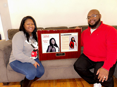 (L-R) Ericka and Willie Logan with the December 2022 edition of the St. Louis Small Business Monthly newsletter.