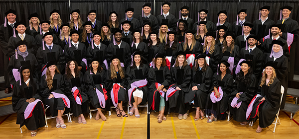 School of Dental Medicine Class Photo in Graduation Cap and Gown